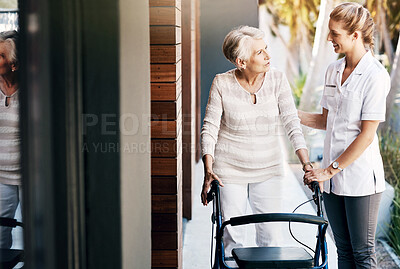 Buy stock photo Women, nurse and senior patient with walker for help, support and happy with care at home. People, smile and person with a disability with caregiver for healthcare, rehabilitation and exercise