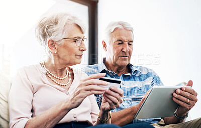 Buy stock photo Credit card, online shopping and tablet with senior couple in home for bank payment or pension. Ecommerce, finance or wealth with elderly man and woman in apartment for application or purchase