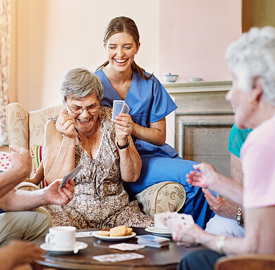 Buy stock photo Senior woman, happy and card game win in retirement home with friends or roommates for recreational fun. Nurse, victory and success in rummy or casino games with biscuits, excitement and smile.