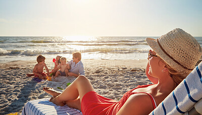 Buy stock photo Family, beach and woman relax on chair in sunshine, blue sky adventure and bonding in summer holiday. Peace, mother and resting by ocean nature, travel and outdoor for tropical vacation in Greece