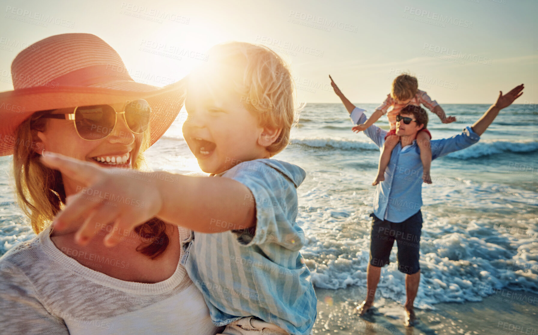 Buy stock photo Happy mother, child and beach with family in sunset for outdoor holiday, weekend or bonding in nature. Mom, father and children playing with kids in sunshine for fun sunny day by ocean coast or sea