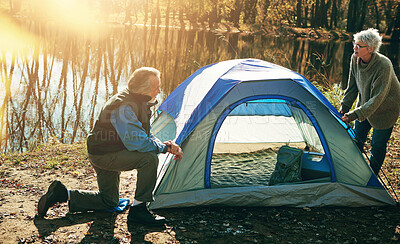 Buy stock photo Old couple, tent and camping with nature, help and vacation with hobby, retirement and conversation. Outdoor, senior man or mature woman with sunshine, mountains or holiday with getaway trip or relax