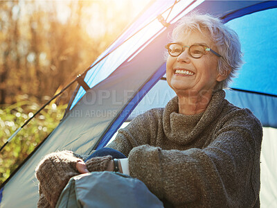 Buy stock photo Camp, mature woman and vacation in tent, smile and outdoor to enjoy nature, freedom and sunshine. Retirement, hobby and morning at campsite, happy and healthy with wellness and relaxing natural view