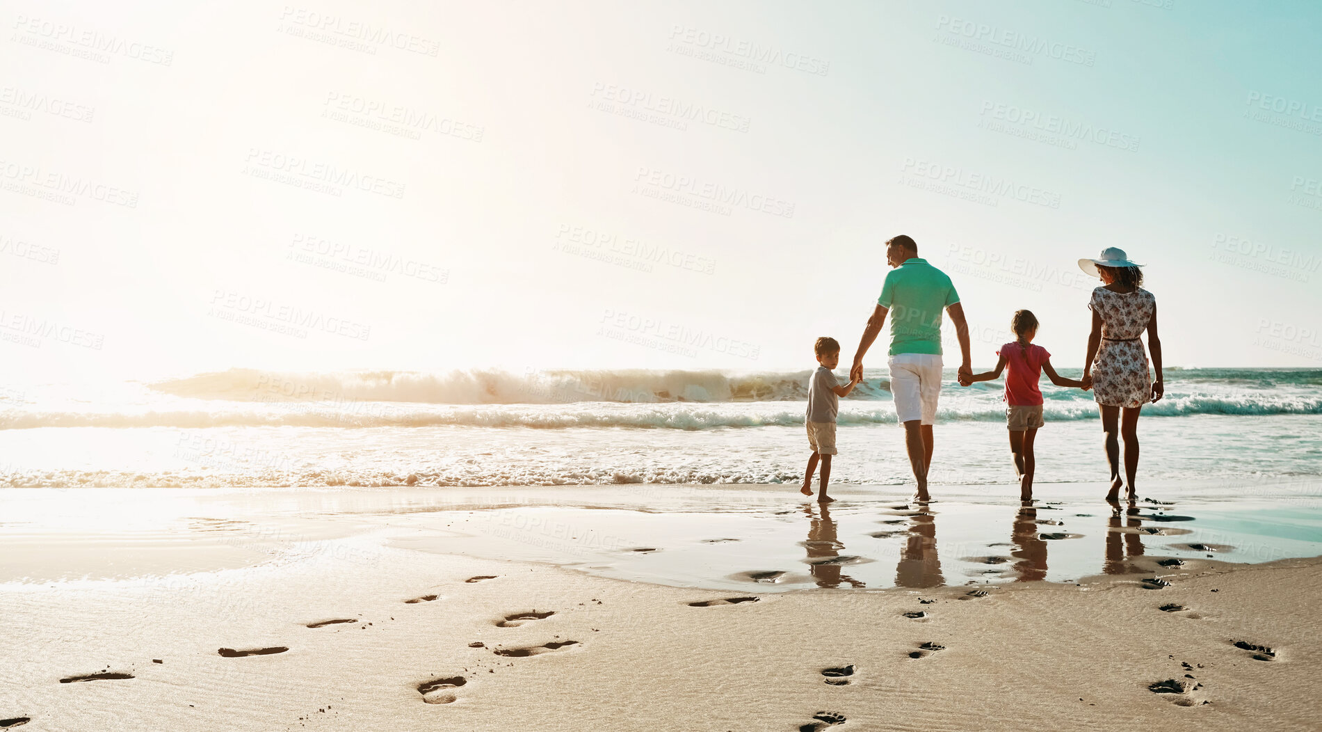 Buy stock photo Happy family, walking and holding hands at beach in summer for relax, travel and holiday in Miami. Parents, children and people at ocean with back for vacation, trust and bonding together by water