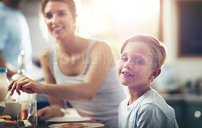 Buy stock photo Boy, child and portrait in kitchen for breakfast or morning routine for healthy diet, vitamins and nutrition. Male kid, mother and happy in home with food for eating or relax, calm and wellbeing.