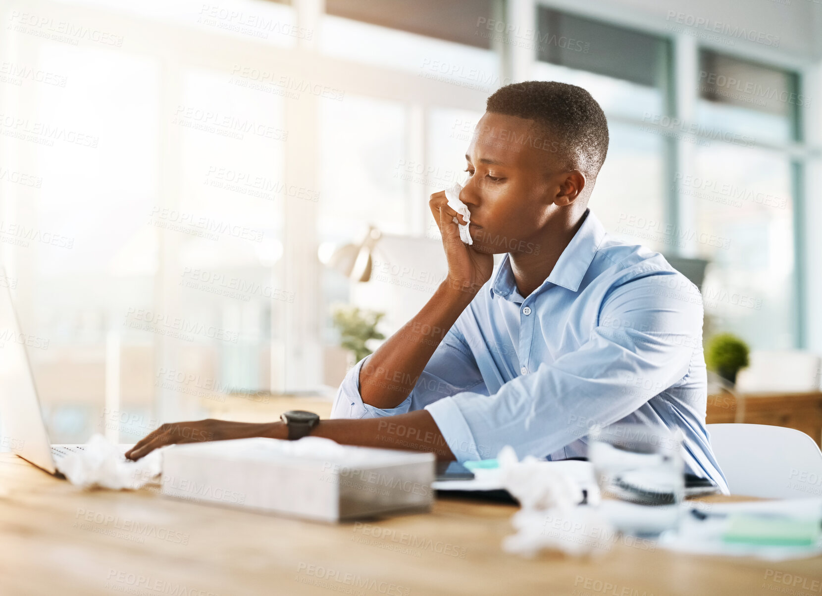 Buy stock photo Black man, laptop and sick in office with tissue for healthcare, flu infection or FLiRT Covid. Male person, company or computer with virus or working with allergy, employee with bacteria or medical