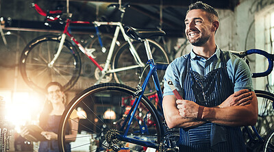 Buy stock photo Happy man, bicycle technician and professional with confidence in small business for fix, repair or maintenance. Confident male person, cycle engineer or bike mechanic with smile for job at workshop