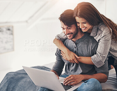 Buy stock photo Couple, laptop and relax or hug in bedroom with online search for holiday destination or discount offers on travel. People, happy or embrace on bed in home with bonding, social media browsing or love