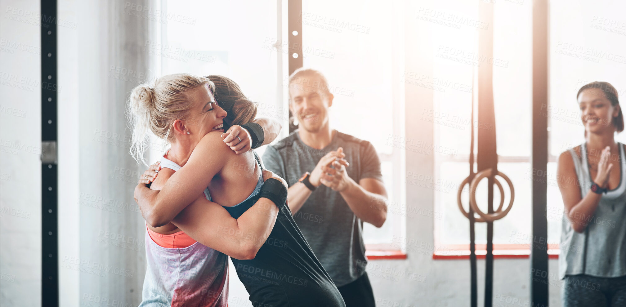 Buy stock photo Fitness, women and celebration hug at gym for support after workout, sports exercise or training challenge. Happy girls, embrace and friends, people smile and achievement together for wellness club