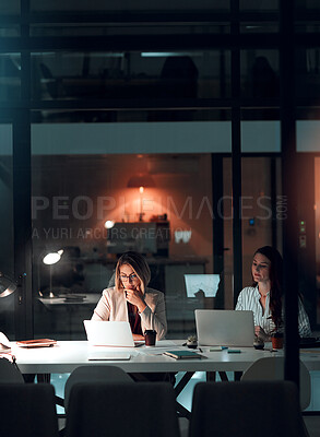 Buy stock photo Night, glass and business women with laptop in office for thinking, collaboration and creative solution. Working late, research and website design team with pc for online, planning or problem solving