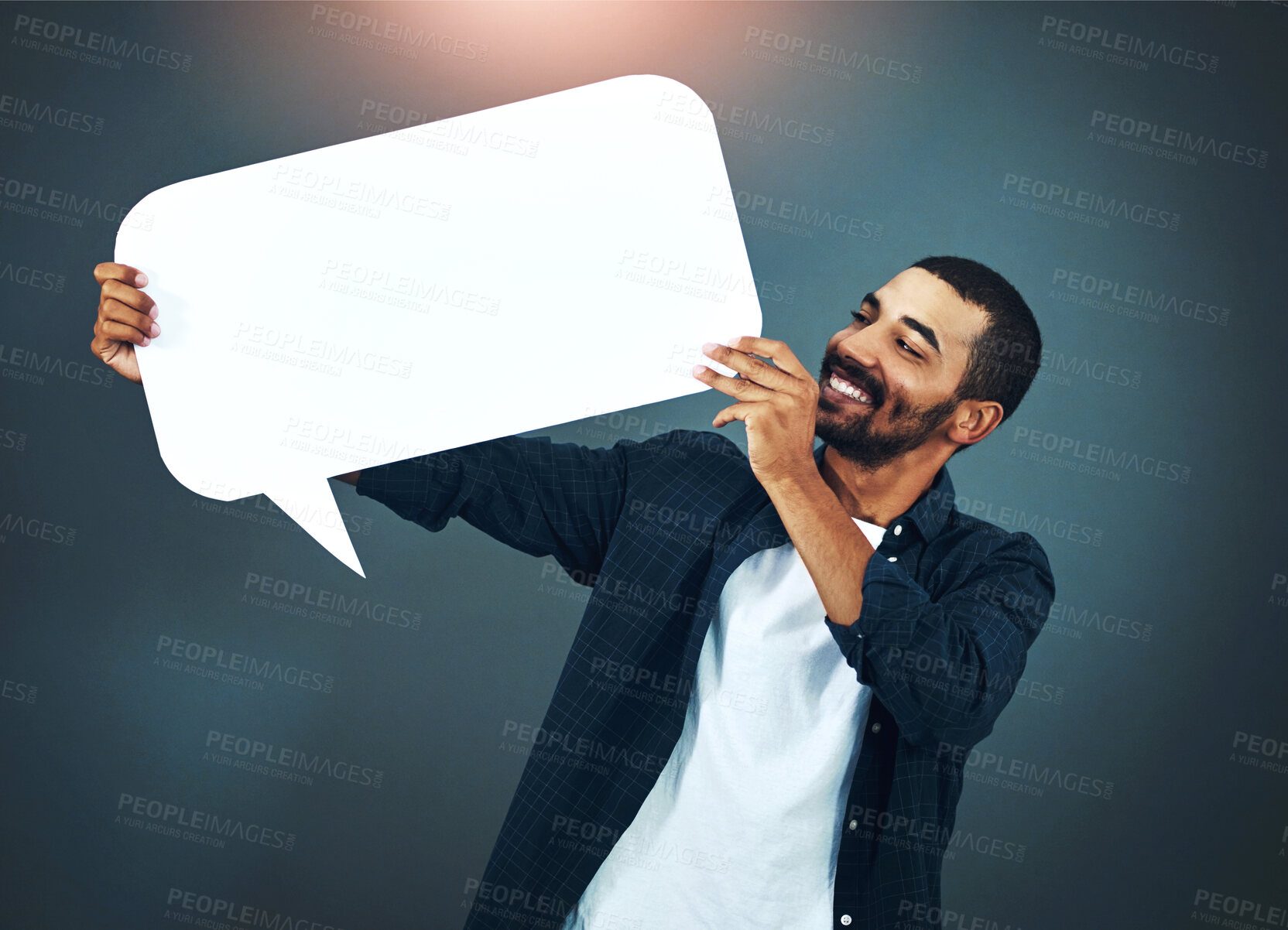 Buy stock photo Man, marketing and speech bubble in studio for advertising, social media and information with smile. Male person, icon and poster with mockup on for review, opinion and billboard on gray background