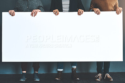 Buy stock photo Poster, team and legs of business people in office for recruitment news, announcement and information. Collaboration, startup and workers with banner and sign for feedback, advertising and promotion