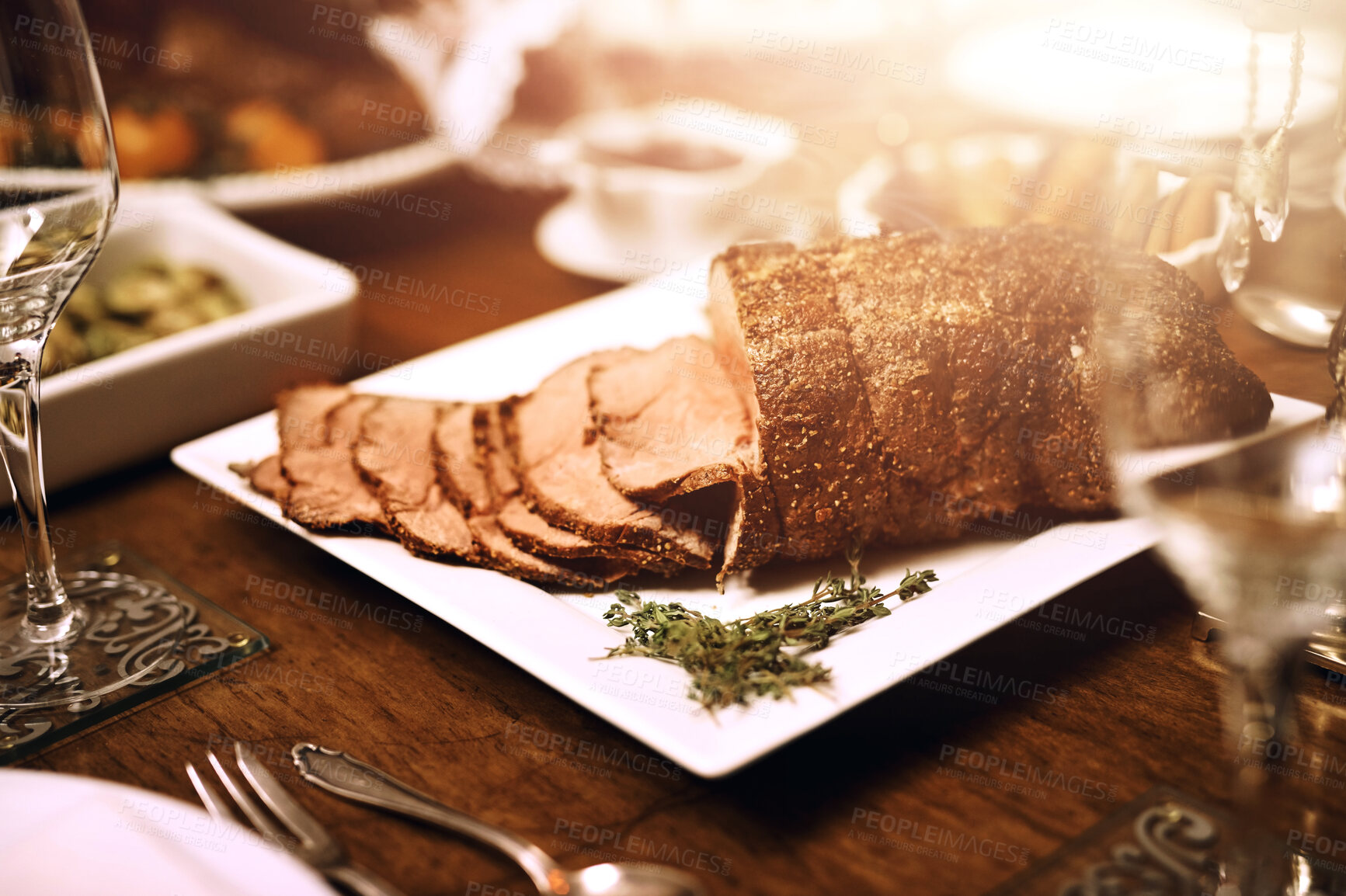 Buy stock photo Holiday dinner, food or table with roast beef for Christmas meal, cut meat or luxury cooking in home. Vacation, house or grill steak for protein with festive season, party with gourmet for wellness