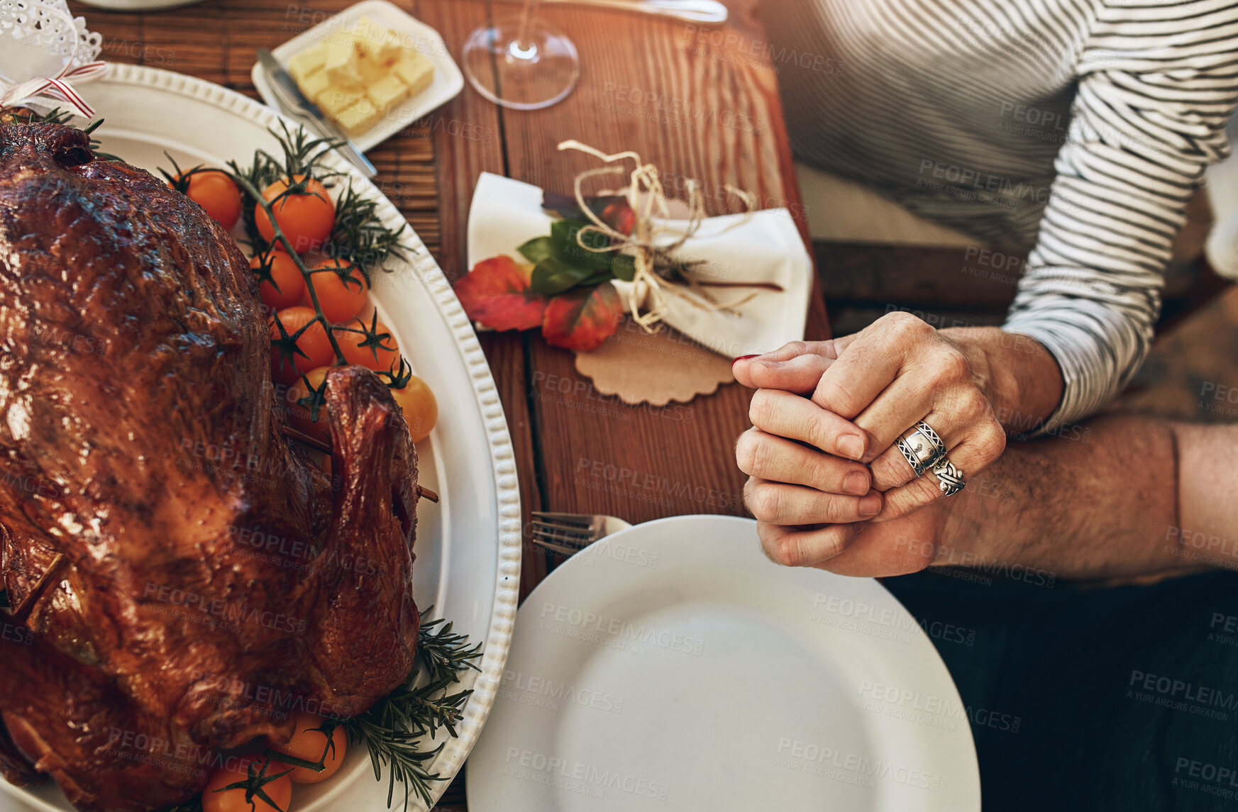 Buy stock photo Hands, couple and prayer at table for thanksgiving, celebration and feast in autumn. Love, support and senior people with food for gratitude, holiday and thank you in family home for religion