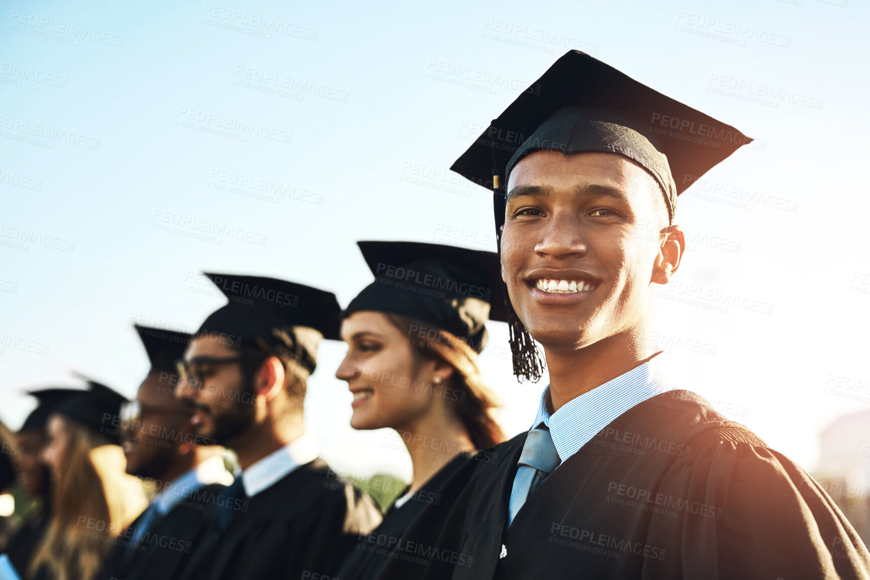 Buy stock photo Happy man, student and graduation class with group at ceremony for education, qualification or future. Portrait of male person or scholar with smile for diploma, certificate or degree on campus