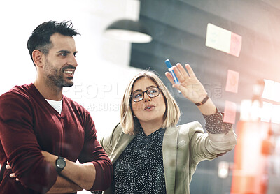 Buy stock photo Business people, creative or sticky note on glass in office, planning or strategy for meeting. Man, woman and startup with ideas or marker for job on wall, entrepreneur and research or brainstorming
