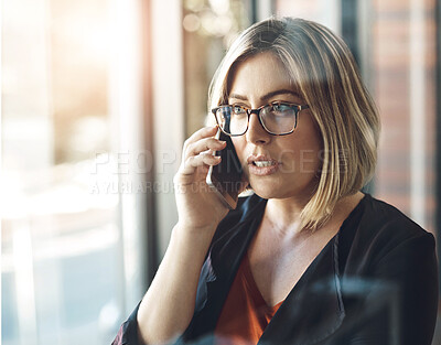 Buy stock photo Phone call, talking and woman in office, serious and communication for investment and proposal for trader. Business, window and conversation with contact, working and entrepreneur with mobile