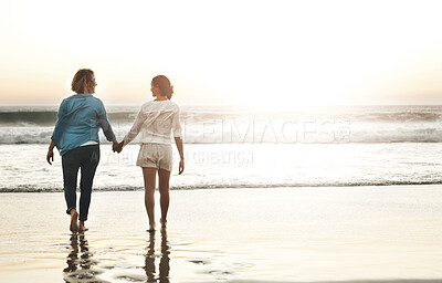 Buy stock photo Back, couple and holding hands in beach, lesbian and walking on sand, vacation and woman with love. Summer, travel and waves in sea, holiday and peace of people, lgbtq and trust in adventure of date