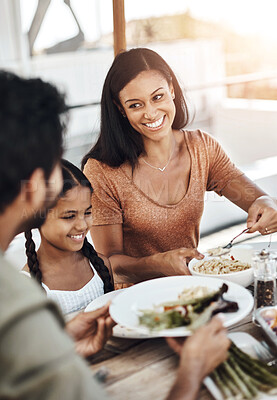 Buy stock photo Parents, kid and happy in home for lunch with food in dining table and bonding. Family, people and smile for support with care or trust and gather to relax, chill and laugh on thanksgiving holiday