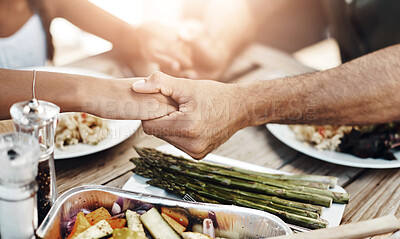 Buy stock photo Hands, praying and food at table for faith, gratitude and worship together at home. Closeup, people and buffet in dining room for lunch, support and healthy meal in afternoon for Christianity