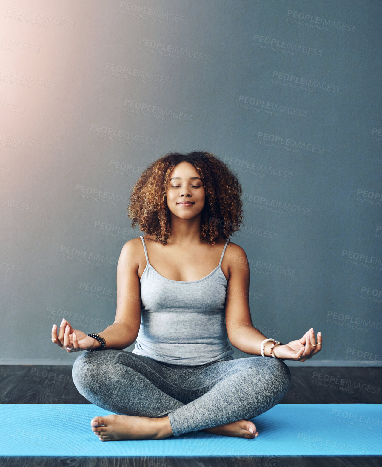 Buy stock photo Meditation, relax and woman on mat in home for mental health, mindfulness and chakra balance. Happy, female person and lotus pose with spiritual healing for holistic, inner peace and awareness