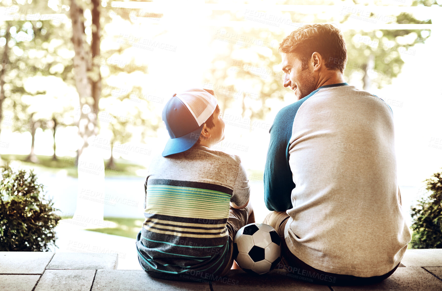 Buy stock photo Father, son and relax with soccer ball for sports, bonding or fun game together on porch at home. Back view of dad sitting with child, kid or little boy for football practice, holiday or weekend