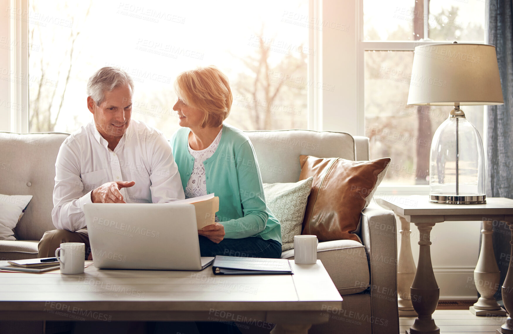 Buy stock photo Documents, laptop and senior couple on sofa with financial report, insurance and investment in home. Retirement, marriage and mature man and woman on computer for finance planning, pension or savings