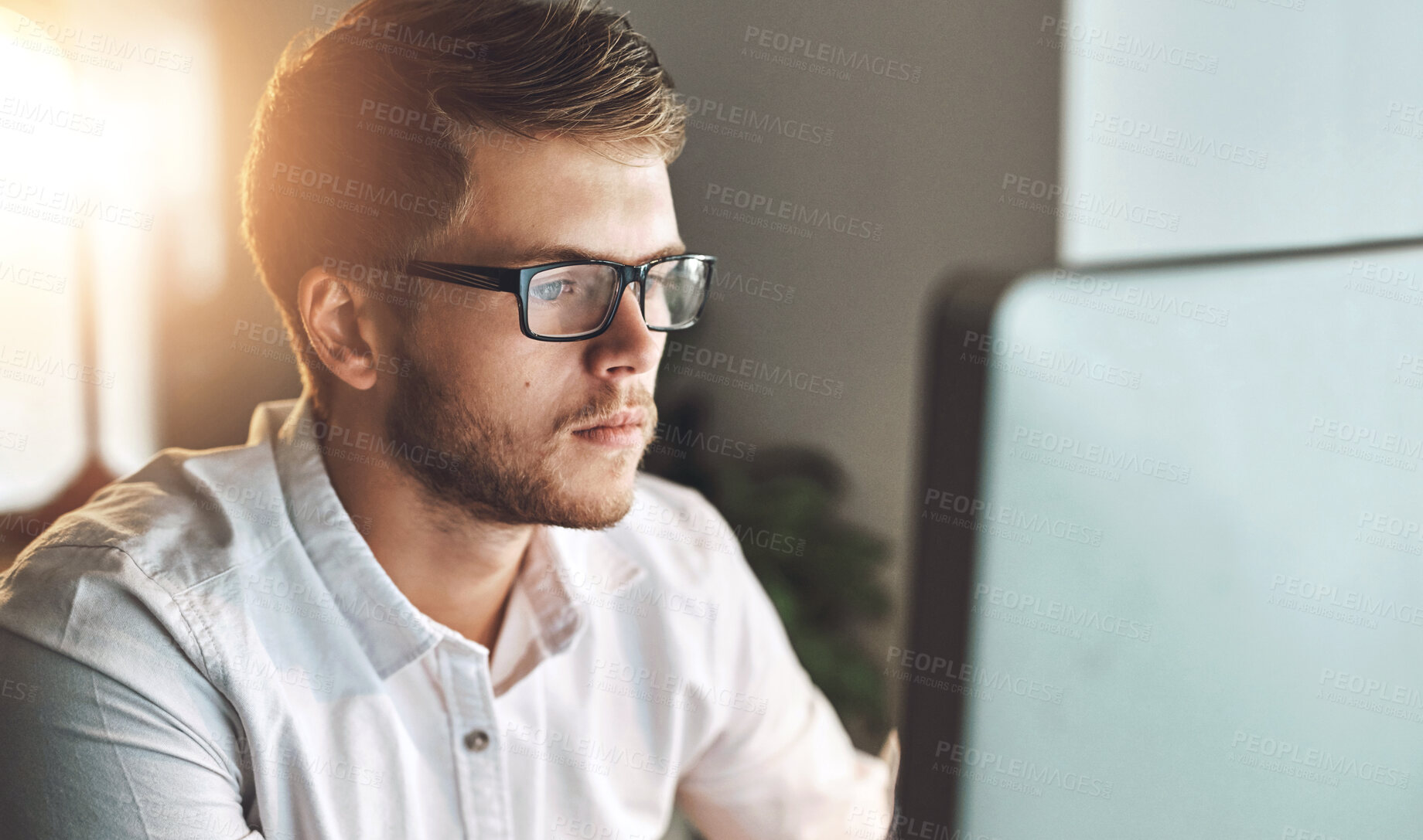 Buy stock photo Computer, glasses and man in office for research on software development for project with technology. Reading, career and male coder working online for database system on desktop in workplace.