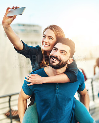 Buy stock photo Outdoor, piggyback and selfie of couple with love, caring and bonding together on vacation in Spain. Dating people, boyfriend and girlfriend with photography for social media, memories and travel