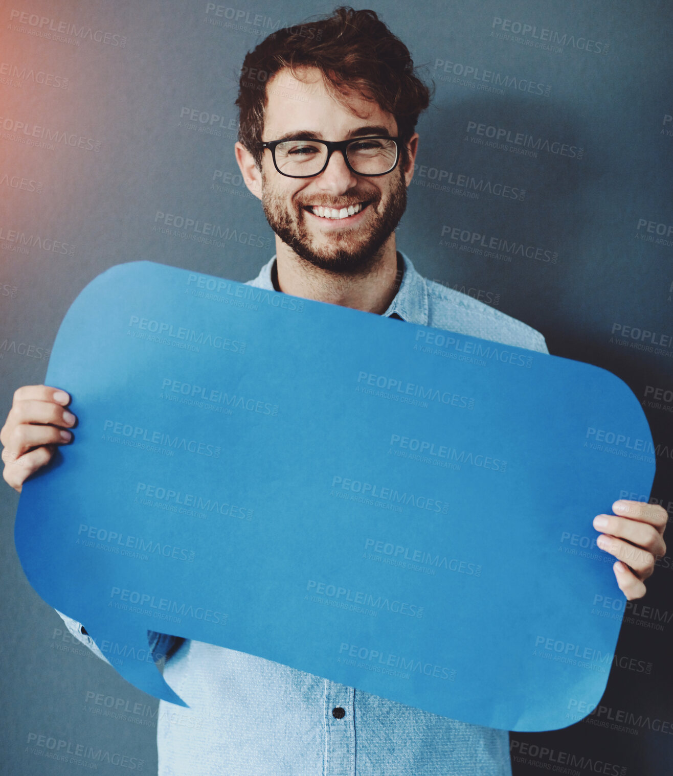 Buy stock photo Businessman, portrait and happy with speech bubble on studio background for FAQ, company announcement or news. Mockup space, cardboard sign and person with poster for social media, feedback and quote