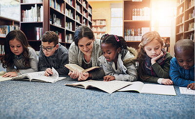 Buy stock photo Children, education and teacher with books on library floor for reading, learning and teaching. Study, school and woman with kids for storytelling, help and fantasy, language and skill development