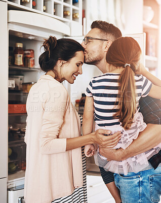 Buy stock photo Happy, home and family with kiss in kitchen for support, child development and love together. Mom, dad and smile with girl kid in house with affection for weekend, care and bonding on fathers day