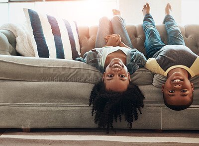 Buy stock photo Upside down, relax and kids on couch, portrait and playing indoors with happiness, weekend break and bonding together in living room. Children, home and boy with girl, cheerful and siblings with fun