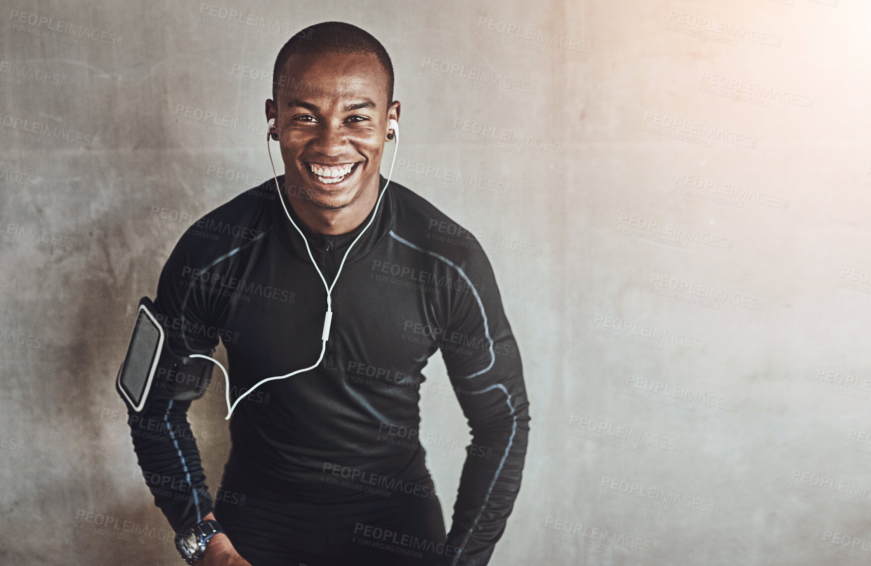 Buy stock photo Portrait, wall background and black man with exercise, listening to music and progress with workout. African person, face and athlete with smile, challenge and training with fitness, podcast or goals