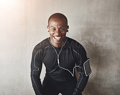 Buy stock photo Portrait, wall background and black man with fitness, listening to music and progress with exercise. African person, face and athlete with smile, challenge and training with workout, podcast or goals