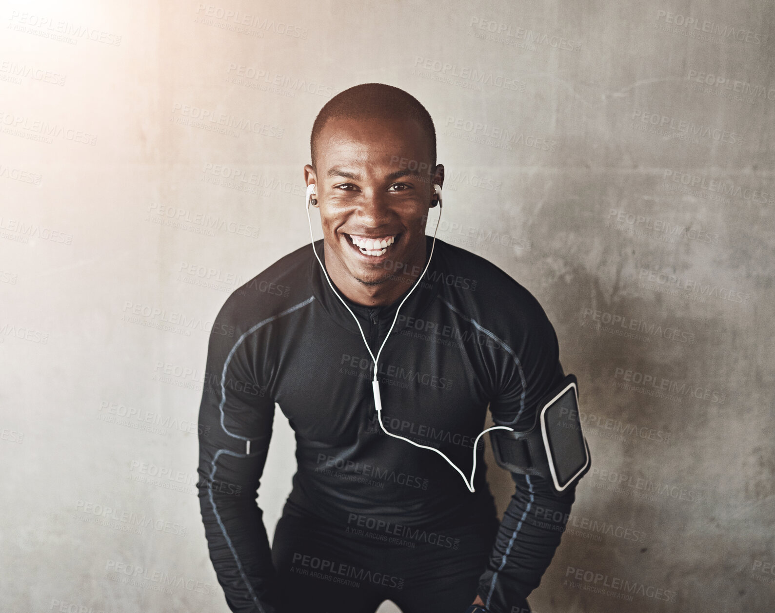 Buy stock photo Portrait, wall background and black man with fitness, listening to music and progress with exercise. African person, face and athlete with smile, challenge and training with workout, podcast or goals