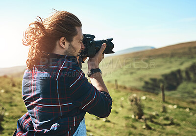 Buy stock photo Nature, photography and man in countryside with camera, memories and adventure in meadow. Professional photographer, outdoor and travel with tech for creativity, environment and field in Norway