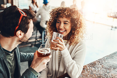 Buy stock photo Date, couple and restaurant with drink, discussion and happy from romance and talk together. Pub, smile and people with conversation, love and bonding with beer and alcohol at bar for anniversary