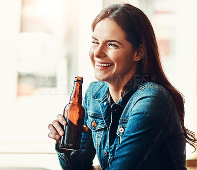 Buy stock photo Smile, happy and woman drinking a beer alone at an restaurant party, event or celebration in afternoon. Fun, trendy bar and bottle with young lady from New York enjoying alcohol beverage in town