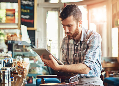 Buy stock photo Barista, tablet and cafe as man in small business with happiness in restaurant or coffee shop. Male person, technology and cafeteria in bistro for food service as employee in startup in New York City