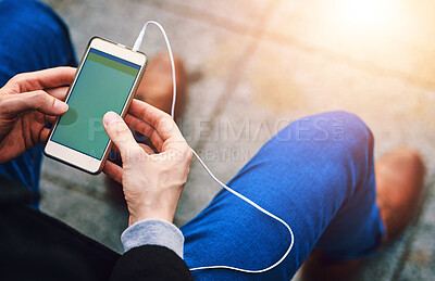 Buy stock photo Man, outside and hands with smartphone or above, music listening and podcast or radio tech with display screen. Online, connectivity and communication for notification message, social media and blog