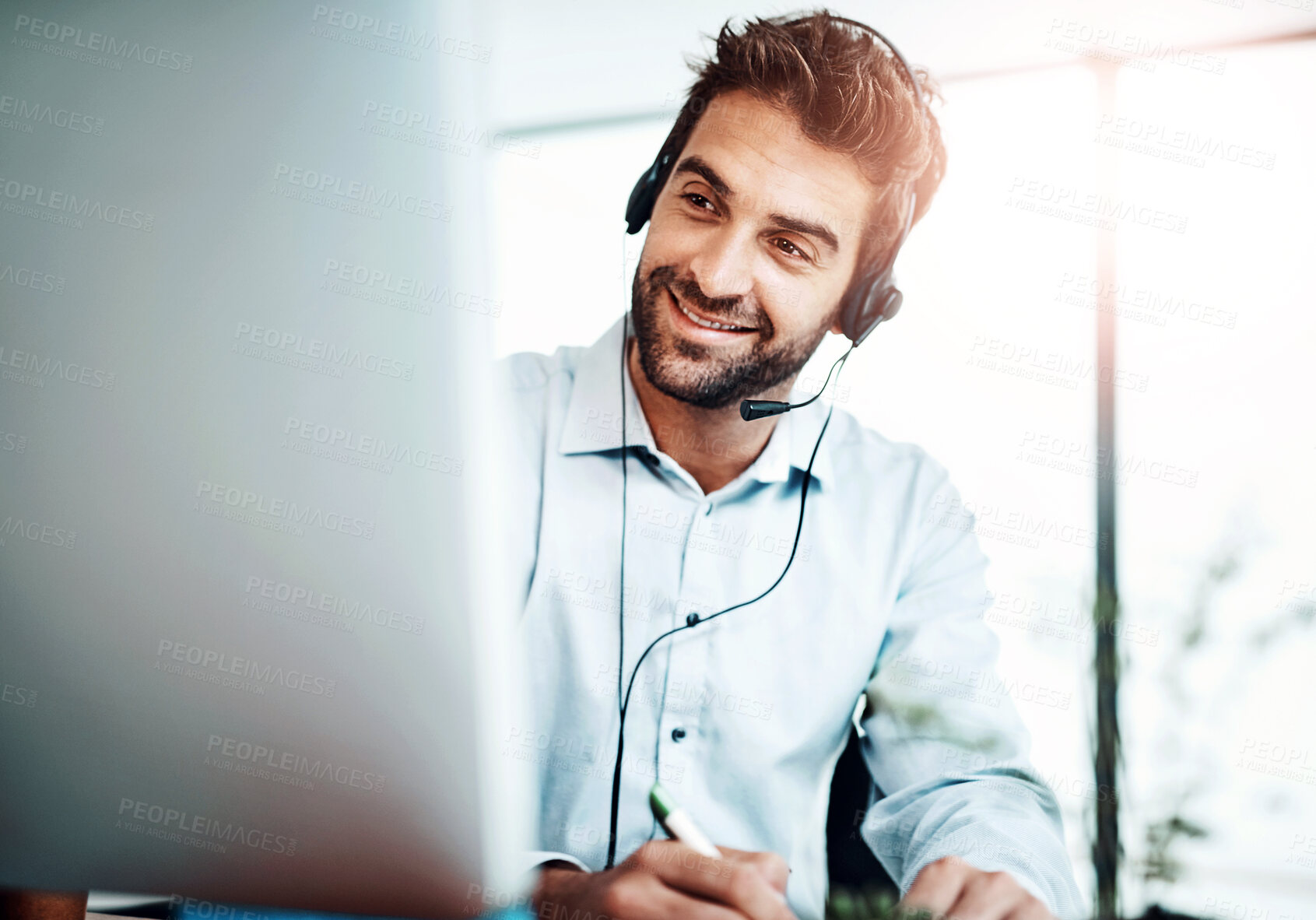 Buy stock photo Call center, telemarketing and man writing notes in office for online consultation appointment. Contact us, computer and male technical support or customer service agent with schedule for feedback.