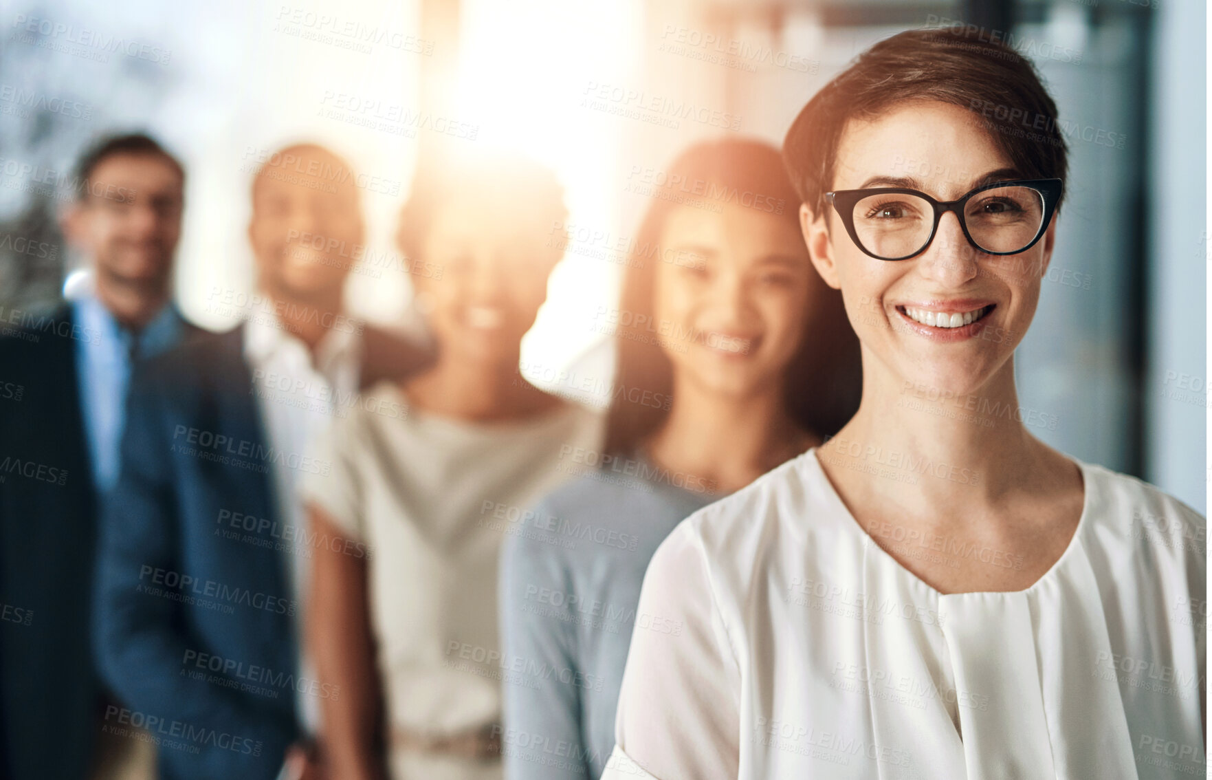 Buy stock photo Happy, business and woman in portrait with team in office for leadership, teamwork and career goals together. Smile, diverse and group of people, pride and collaboration as creative startup agency