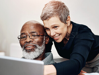 Buy stock photo Senior couple, laptop or help in home for website, together for online shopping with advice. Sofa, computer or woman with assistance for man with glasses, interracial people in apartment with tech