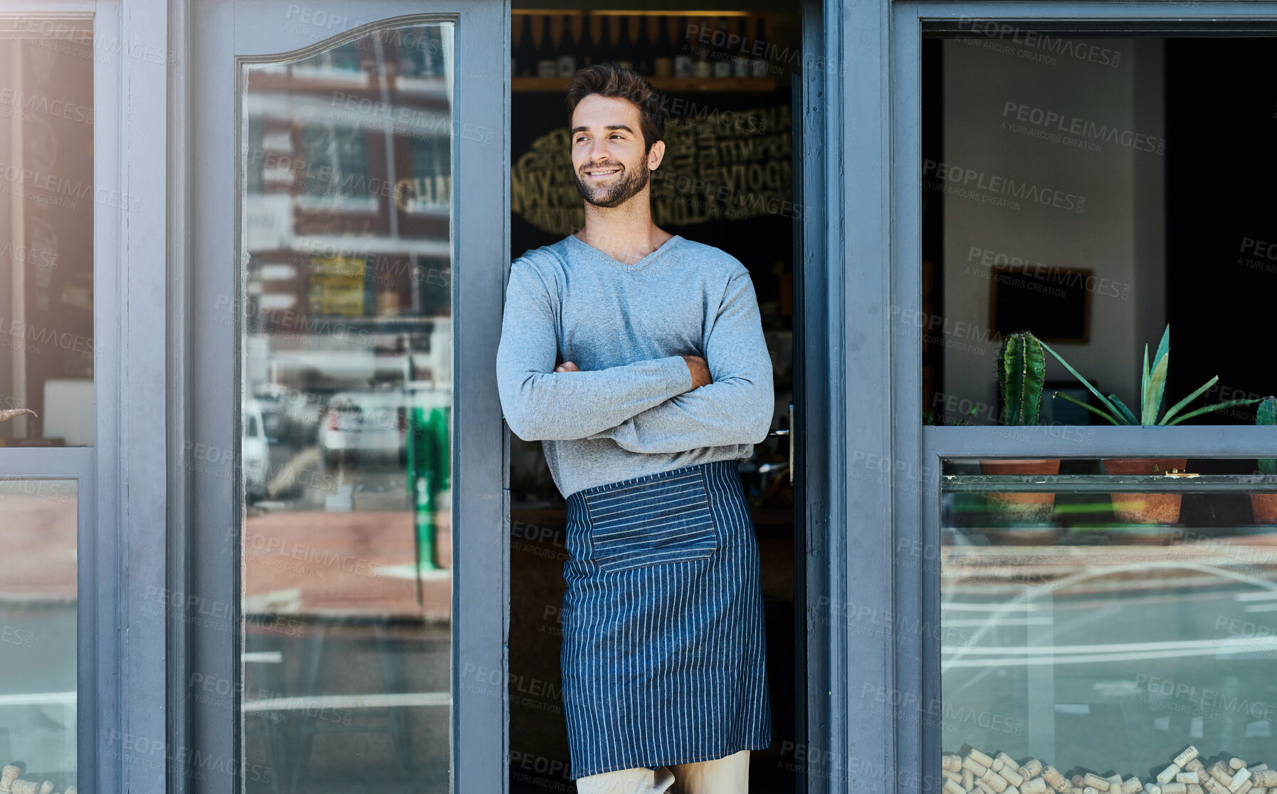 Buy stock photo Arms crossed, waiter and man in cafe at door with confidence in startup or small business and ownership. Coffee shop, proud and smile or happy as entrepreneur with restaurant progress and growth