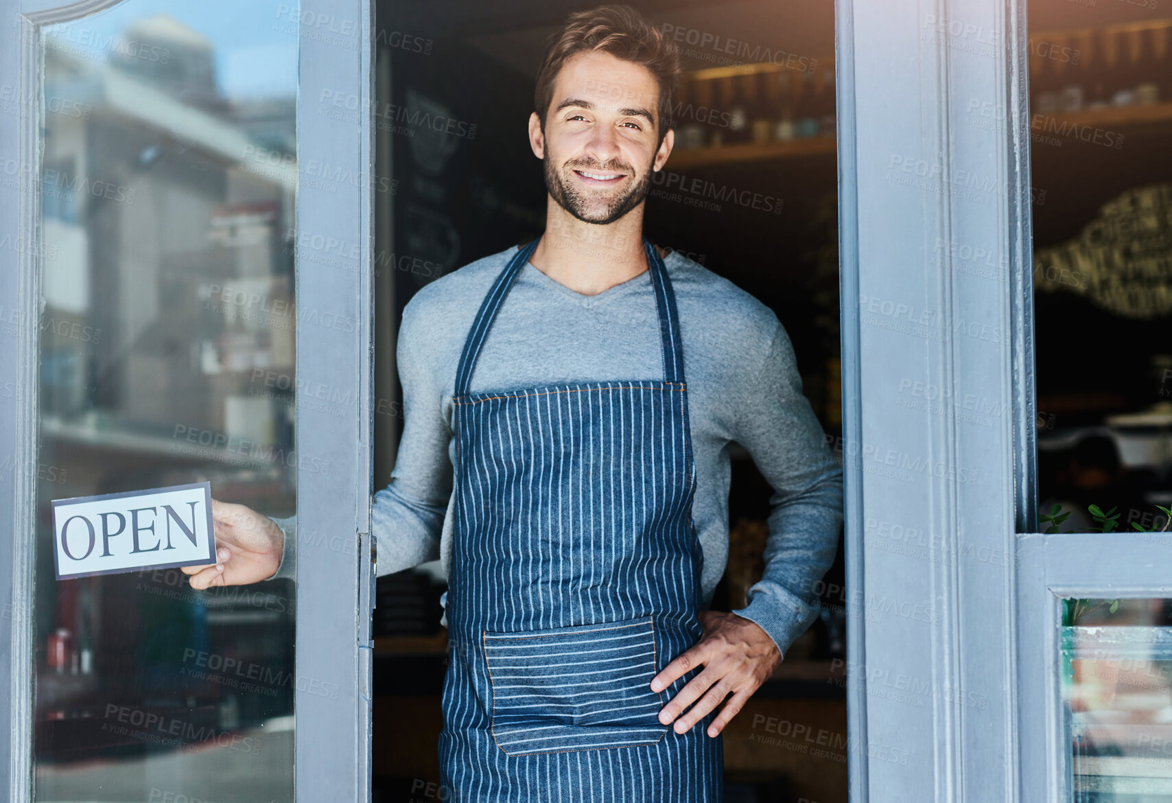 Buy stock photo Portrait, waiter and man at cafe with open sign in smile for startup or small business and ownership. Coffee shop, confidence and happy or satisfied at restaurant with welcome note for customers