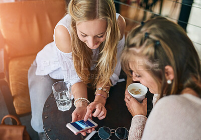 Buy stock photo Coffee shop, friends and women with phone in restaurant for talking, social chat and relax together. Cafeteria, happy and people on smartphone with caffeine beverage, cappuccino and drink in cafe