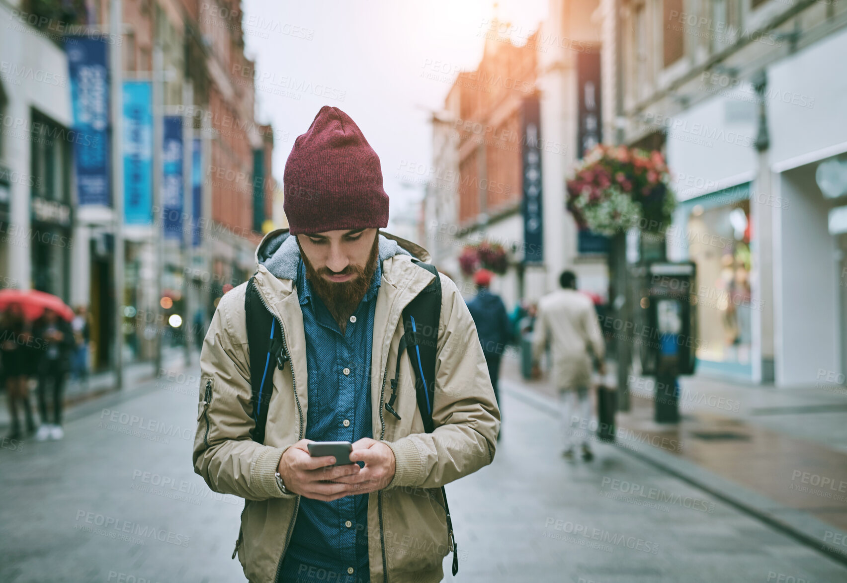 Buy stock photo Walking, street and phone of man with travel, direction and road in London on vacation. Location app, urban and journey with navigation, text and digital guide for holiday in city with mobile