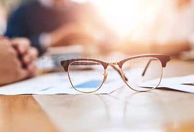 Buy stock photo Vision, optometry and glasses on desk in office with financial paperwork for budget report. Optical, eyewear and spectacles with prescription lenses by accounting documents for project in workplace.