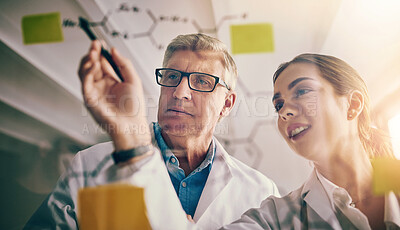 Buy stock photo Scientists, notes and research with planning, writing and innovation for experiment or discussion in laboratory. Man, woman and glass wall with medical, pharmaceuticals and science formula for drugs